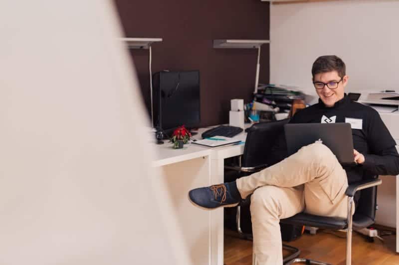 Man on laptop in digital workspace